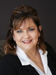 A person smiling for the cameraDescription automatically generated with low confidence